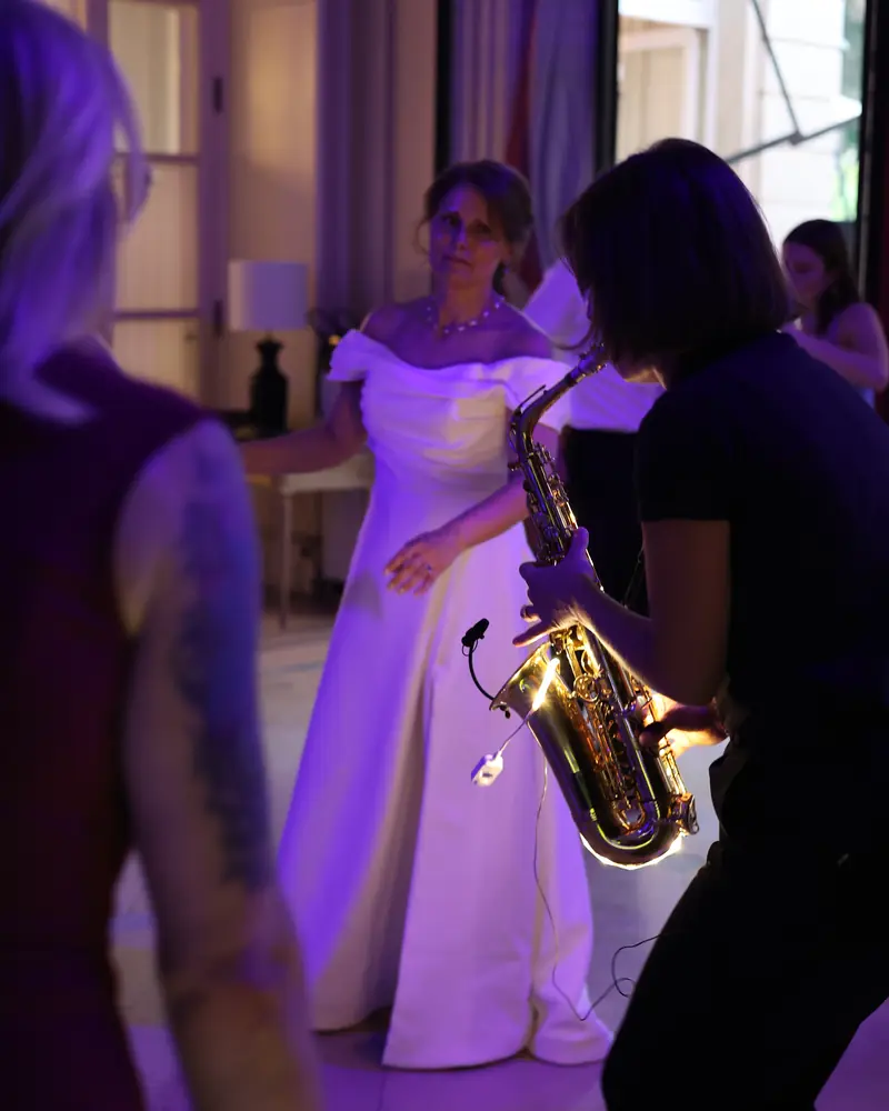 The saxophonist playing for the bride on the dance floor (photo by Vally Photography)